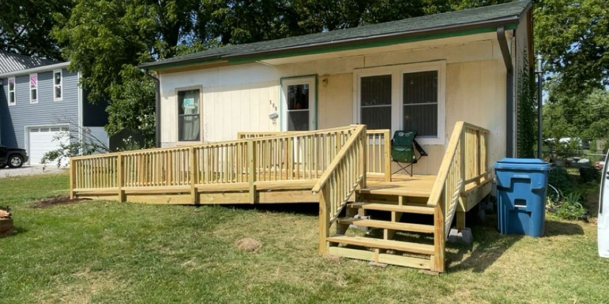 Residential house with a newly built wooden accessibility ramp